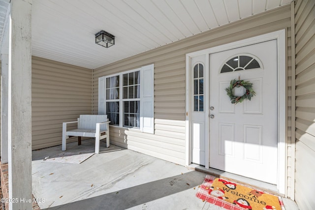 doorway to property with a porch