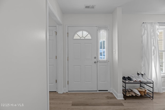 foyer entrance with light hardwood / wood-style flooring