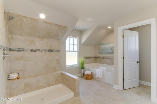 bathroom with tile patterned flooring, plus walk in shower, and vaulted ceiling