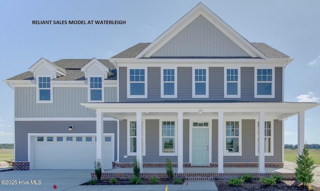 view of front of house featuring a porch and a garage