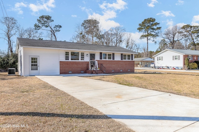 single story home featuring central AC unit and a front lawn