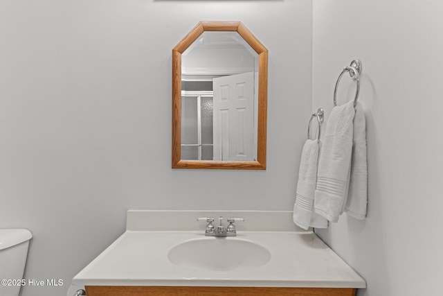 bathroom with vanity and toilet