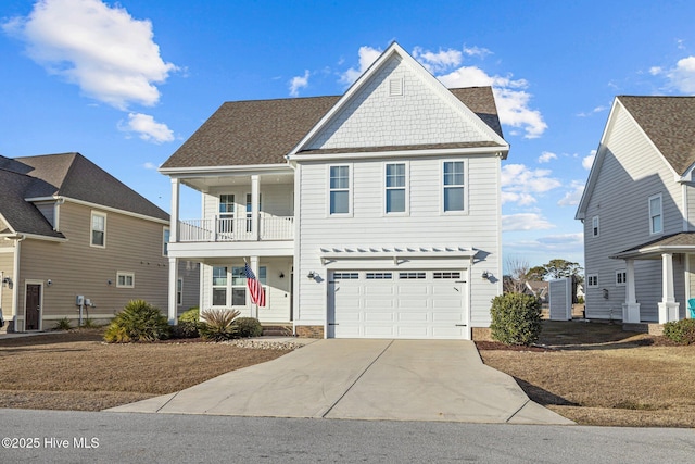 front facade featuring a balcony and a garage