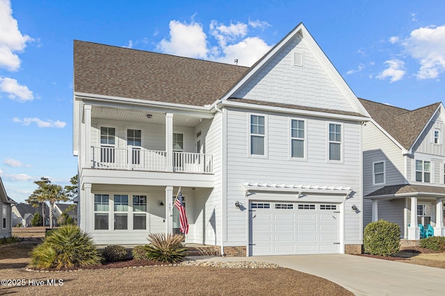 view of front of home featuring a balcony and a garage