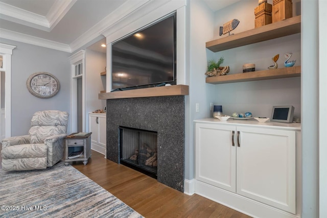 living room featuring ornamental molding and dark hardwood / wood-style floors