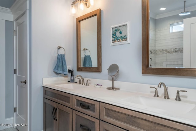 bathroom featuring crown molding, vanity, and walk in shower