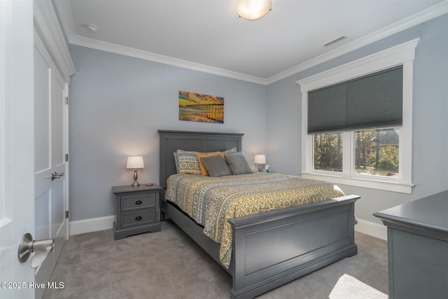 bedroom featuring crown molding and carpet