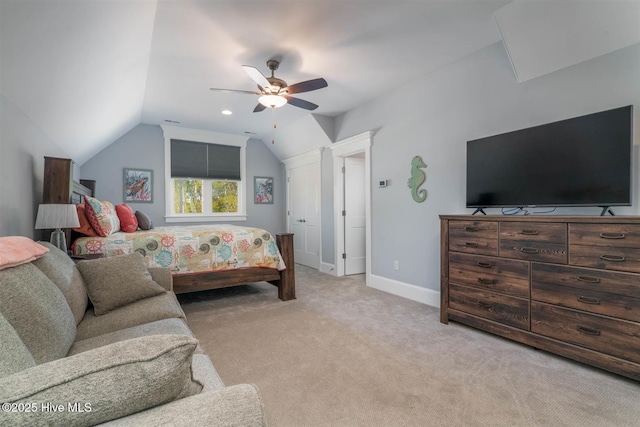 carpeted bedroom with vaulted ceiling and ceiling fan