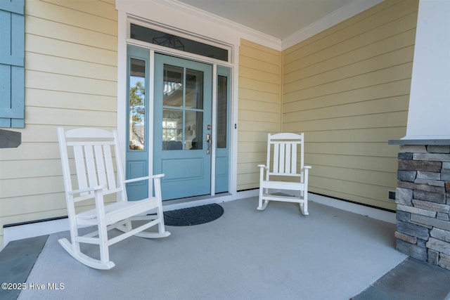 entrance to property featuring covered porch