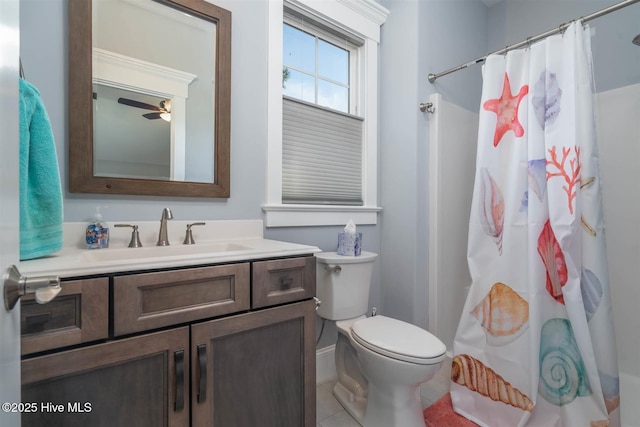 bathroom featuring vanity, ceiling fan, toilet, tile patterned floors, and a shower with curtain