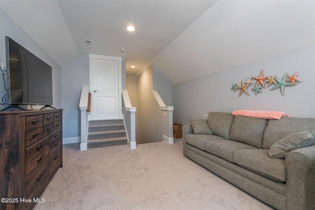 carpeted living room with lofted ceiling