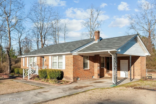 view of front of home with a carport