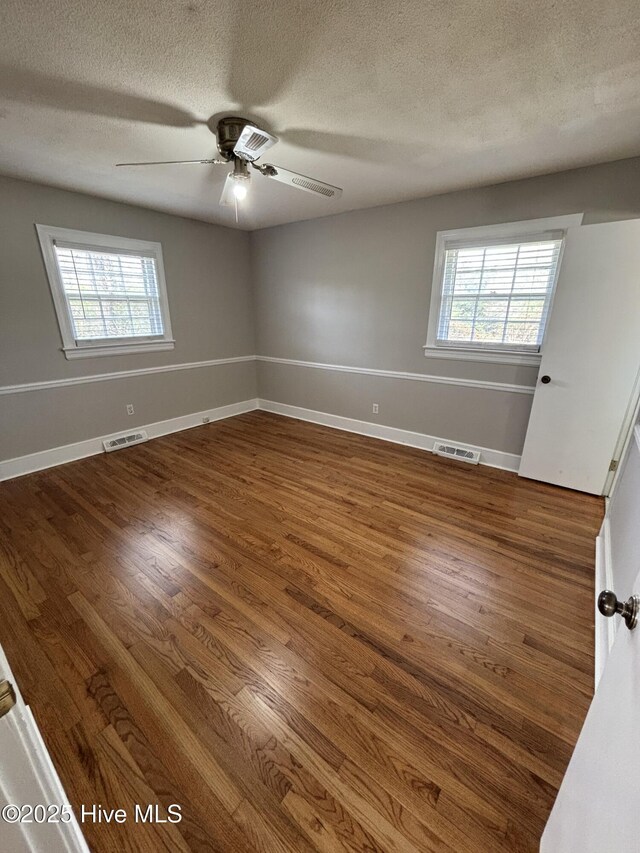 carpeted bedroom with a textured ceiling, a closet, and ceiling fan