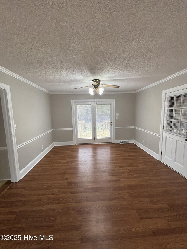 carpeted living room featuring a textured ceiling, ceiling fan, ornamental molding, and plenty of natural light