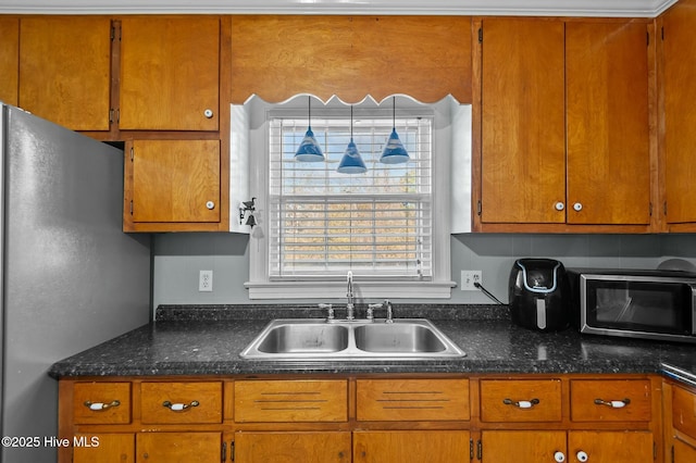 kitchen with appliances with stainless steel finishes and sink