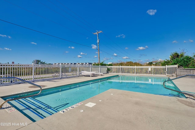 view of swimming pool featuring a patio area