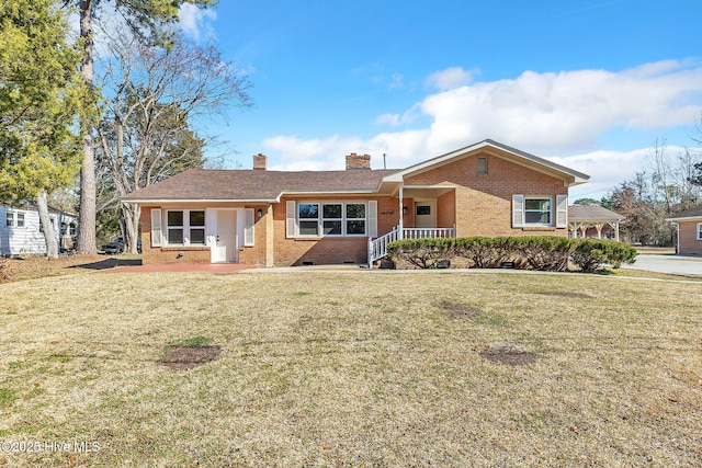 ranch-style house featuring a porch and a front yard