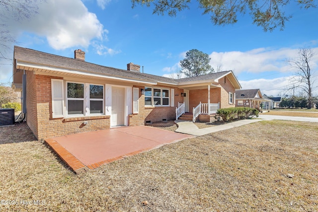 single story home featuring a porch, central AC unit, a front lawn, and a patio