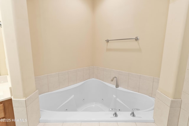 bathroom with a relaxing tiled tub and vanity