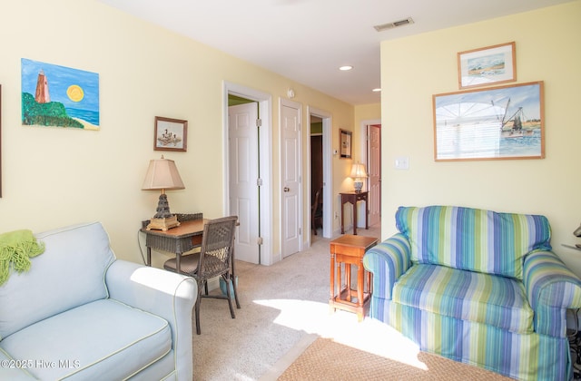 living room featuring light carpet