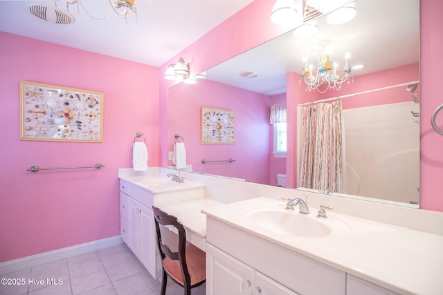 bathroom with toilet, vanity, tile patterned floors, an inviting chandelier, and a shower with shower curtain