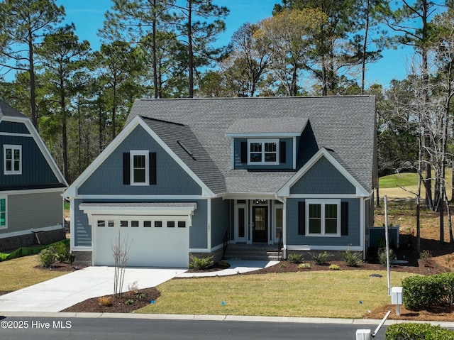 craftsman inspired home with a front lawn and a garage