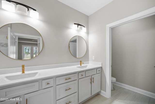 bathroom with vanity and toilet