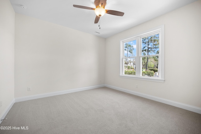 carpeted empty room with ceiling fan