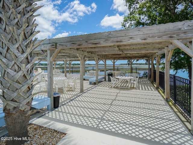 exterior space featuring a pergola and a water view