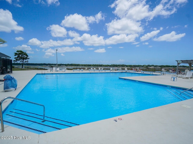 view of pool featuring a patio