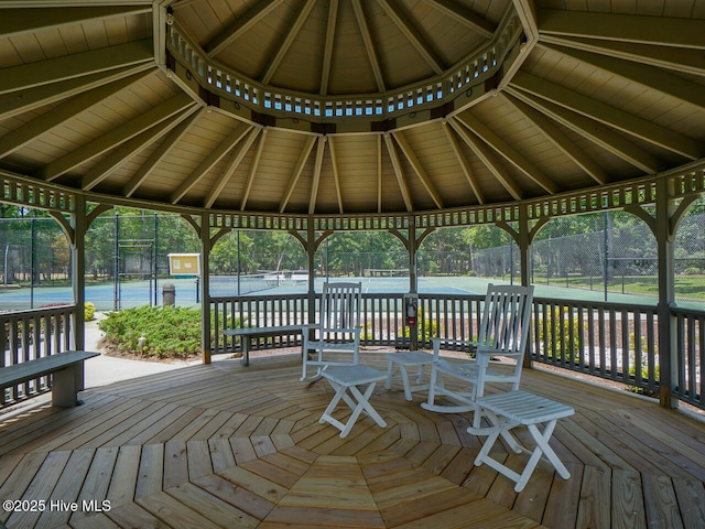 deck featuring a gazebo and tennis court