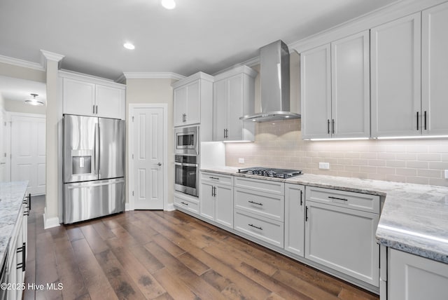 kitchen featuring white cabinets, wall chimney exhaust hood, and stainless steel appliances