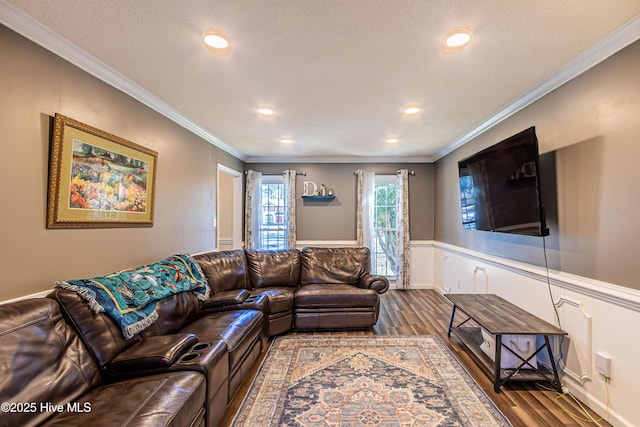 living room with dark hardwood / wood-style floors and ornamental molding