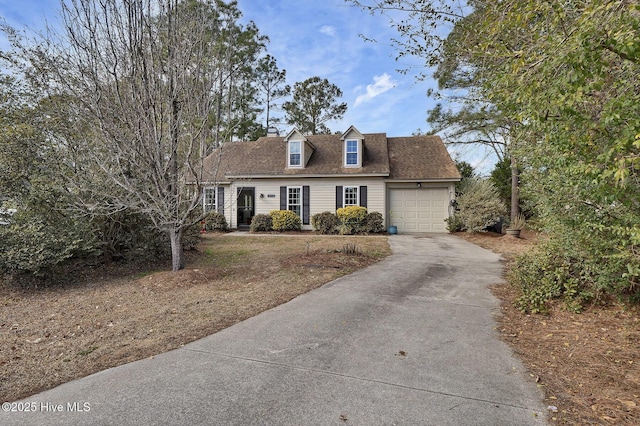 cape cod-style house with a garage