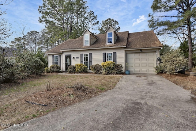 new england style home with a garage