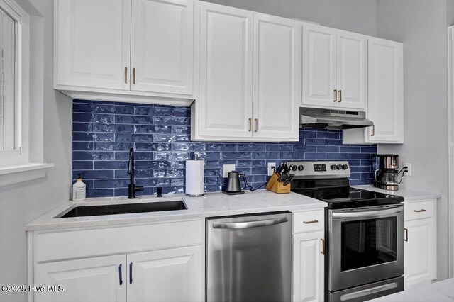 kitchen with pendant lighting, blue cabinetry, white cabinetry, dark hardwood / wood-style flooring, and vaulted ceiling