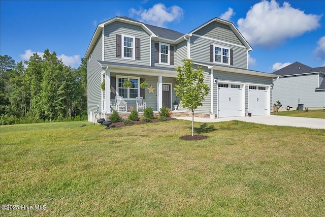 view of front of home with covered porch, a front yard, and a garage