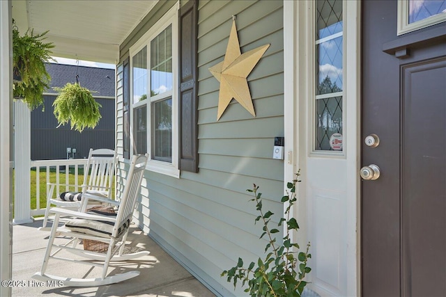 property entrance with covered porch