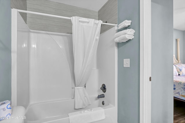 bathroom with shower / bath combination with curtain