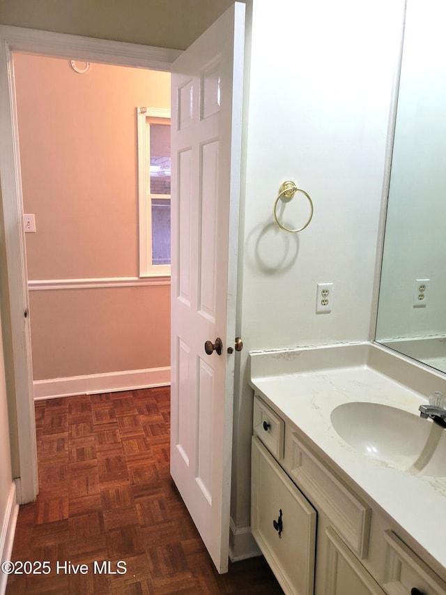 bathroom featuring vanity and baseboards