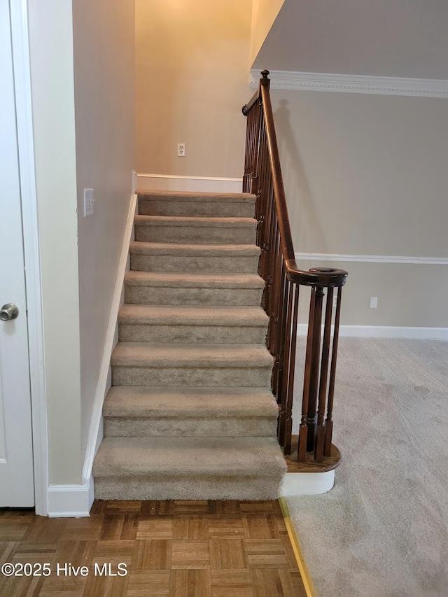 stairway featuring baseboards