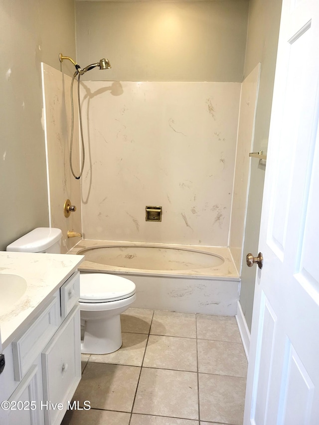 bathroom with tile patterned flooring, toilet, vanity, and  shower combination