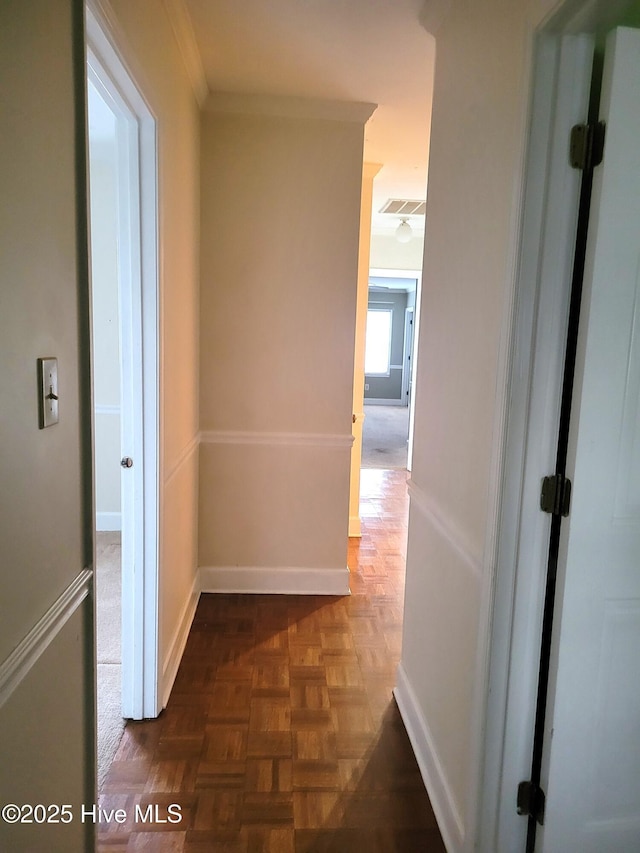 corridor with visible vents and baseboards