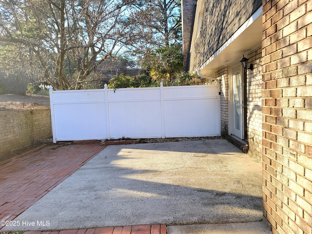 view of patio / terrace featuring fence