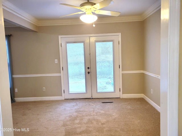 entryway featuring french doors, carpet floors, and ornamental molding