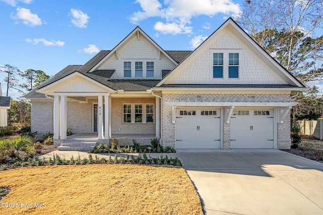 craftsman-style home with a porch and a garage