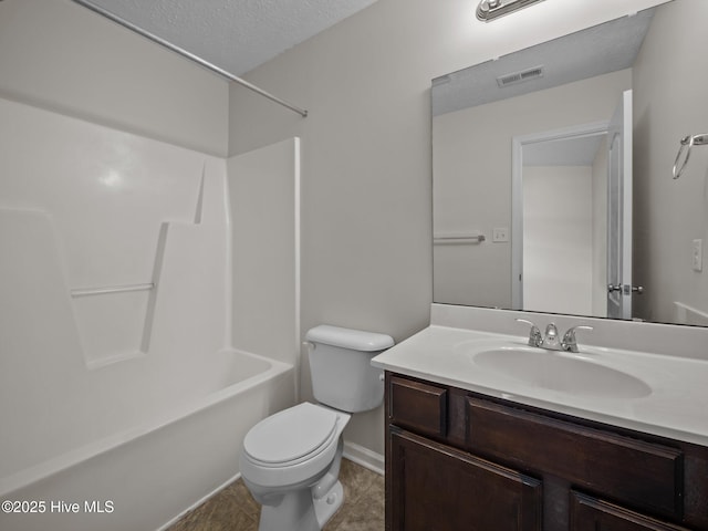 full bathroom featuring a textured ceiling, shower / bath combination, vanity, and toilet