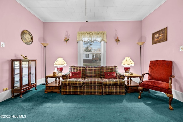 sitting room with ornamental molding and carpet flooring