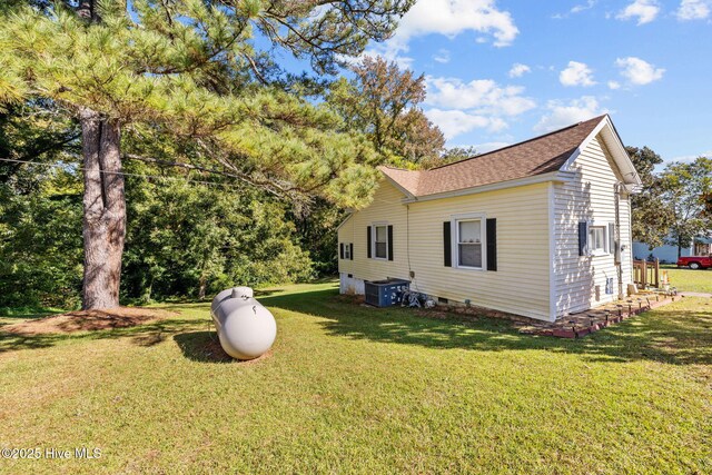 rear view of house with a lawn