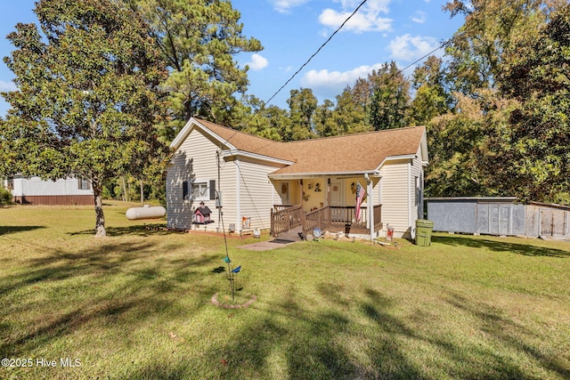 back of property featuring a yard and a porch